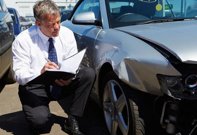 car keys on top of a car insurance brochure